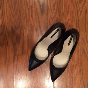 Black pointed toe pumps